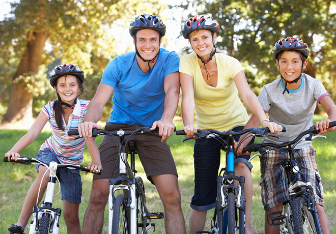 42249271 - family on cycle ride in countryside