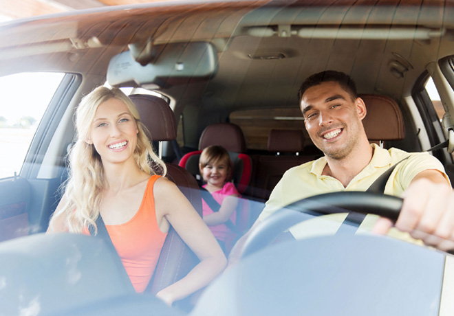 48854090 - family, transport, safety, road trip and people concept - happy man and woman with little child driving in car